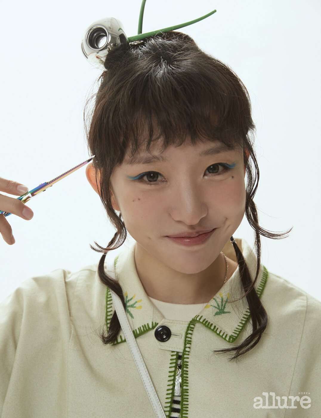 K-idol beauty looks showcasing detailed eye makeup and eyeliner application