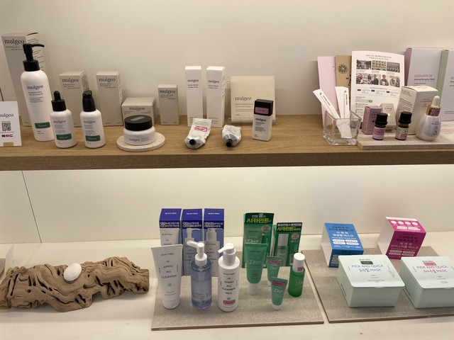 A scene showing various skincare and makeup products from different brands displayed on the Beauty Play product display shelves