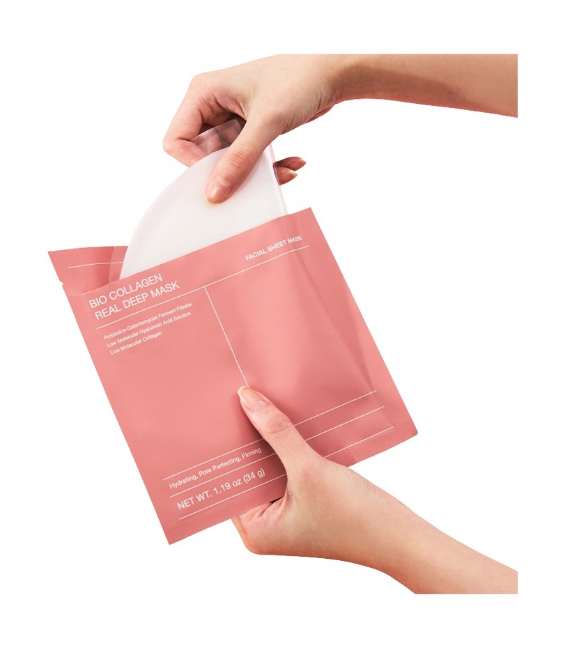 A look holding a bio collagen deep mask sheet — a skincare product in a sheet-mask format that travelers can use easily