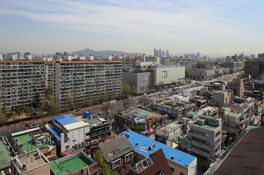 This is a photo looking down from a high place over the area around Galleria Department Store West and Apgujeong Rodeo Street..