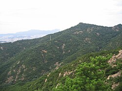 This is a panoramic view of Achasan following to the rocky ridge and forest..
