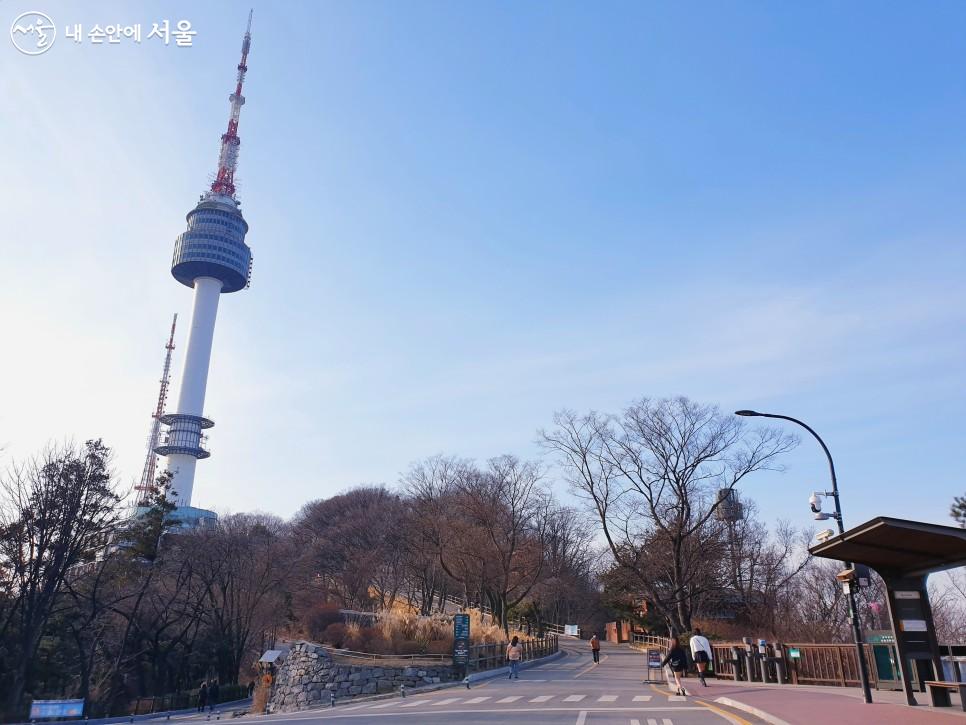 The uphill path in Namsan Park and NA panoramic view of Seoul Tower.