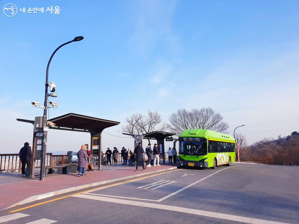 NThe Namsan Circular Bus stopped at the Seoul Tower bus stop 01No..