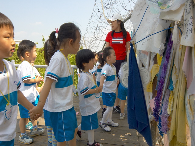 Visitors are looking at Freedom Bridge at Paju Imjingak.