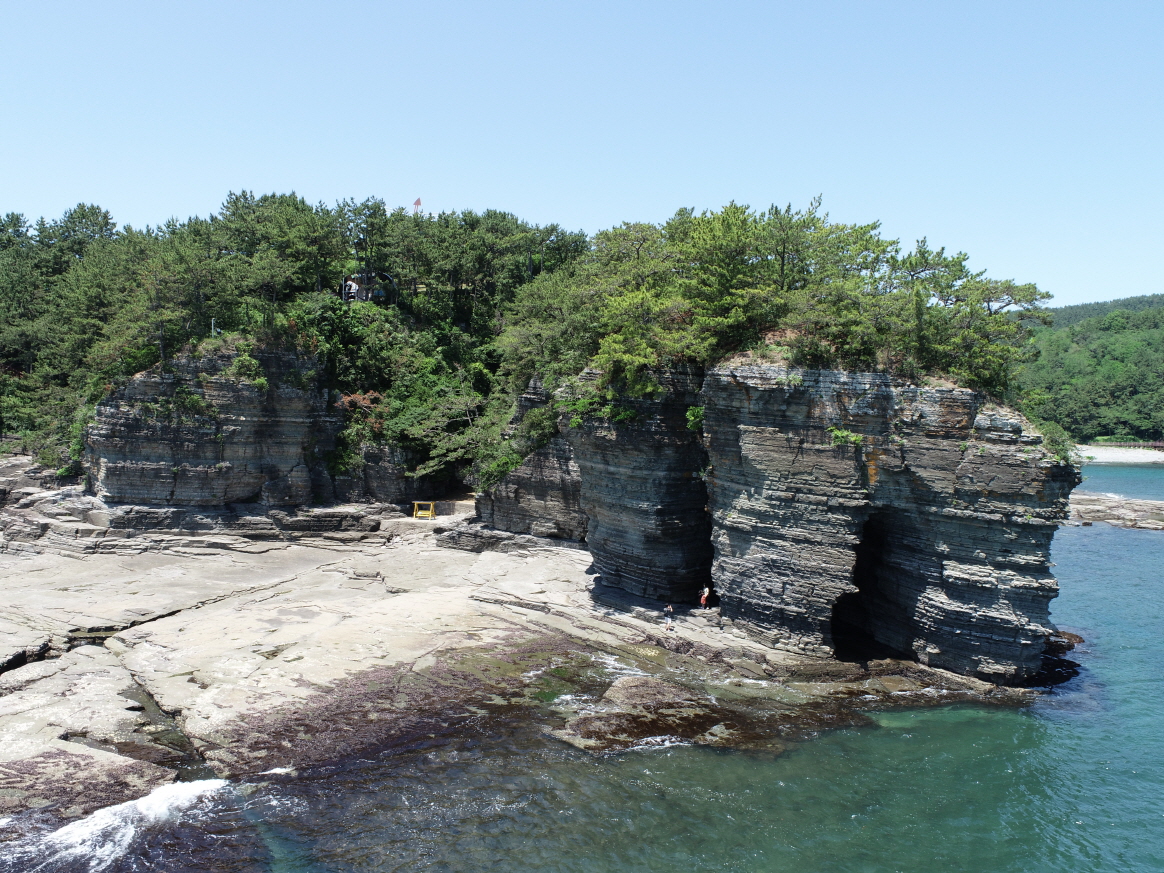 Reading Footprints on the Rocks at Goseong Deokmyeong-ri Coast Before the Tide Comes In